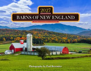 Farm scene with a red barn and silo, green fields, autumn trees, and distant blue mountains under a clear sky; watermark at bottom.