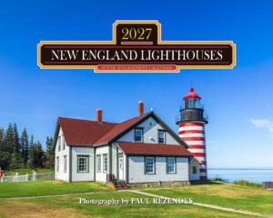 Promotional sign for the 2027 New England Lighthouses scenic engagement calendar over a lighthouse and house against a blue sky.