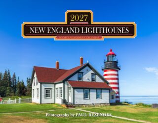 Promotional sign for the 2027 New England Lighthouses scenic engagement calendar over a lighthouse and house against a blue sky.