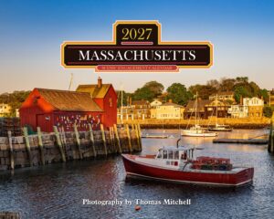 Harbor scene with a red boathouse and boats along the water, overlaid by a large Massachusetts 2027 Scenic Engagement Calendar logo.