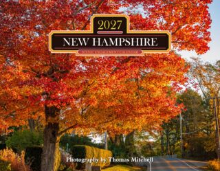 Autumn scene of orange-red maple leaves along a road, with a decorative calendar banner reading 'New Hampshire 2027' and 'Scenic Engagement Calendar' across the center.